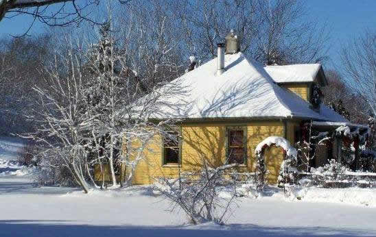 The Cottage Draped in Winter Snow